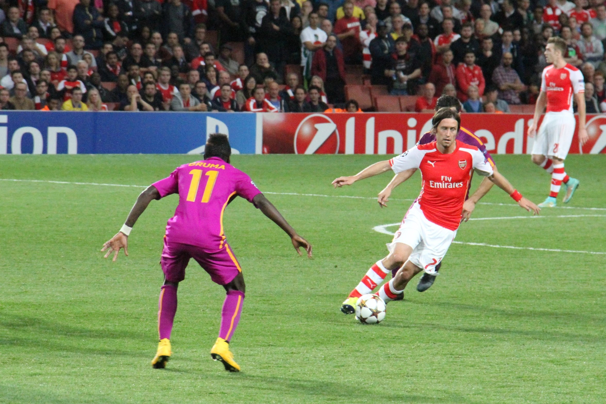 several soccer players engaged in a game