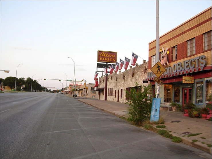 the sign for bubba stew's pizza company is hanging out on the side of the street