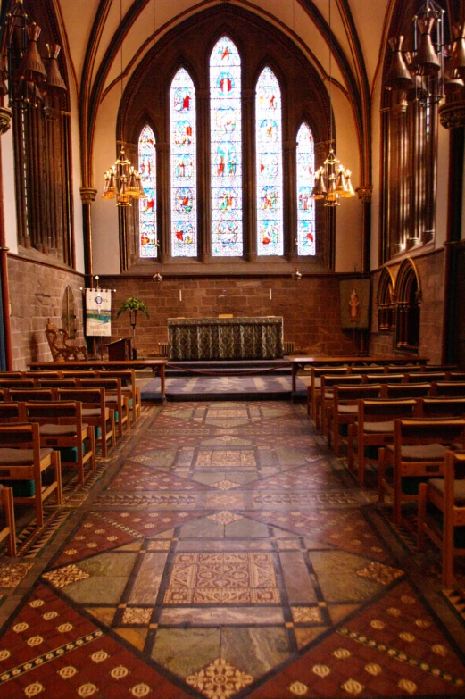 empty chairs in front of stained glass windows