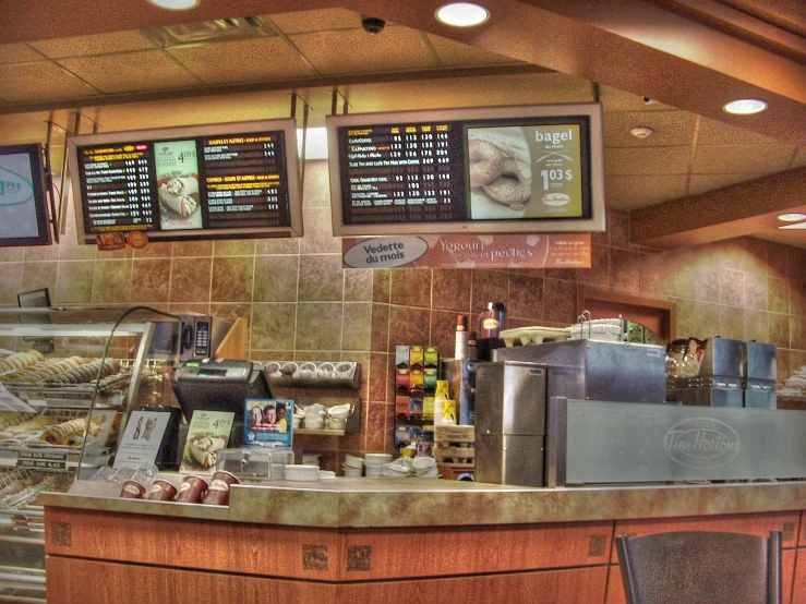 an empty restaurant with the counters showing pastries