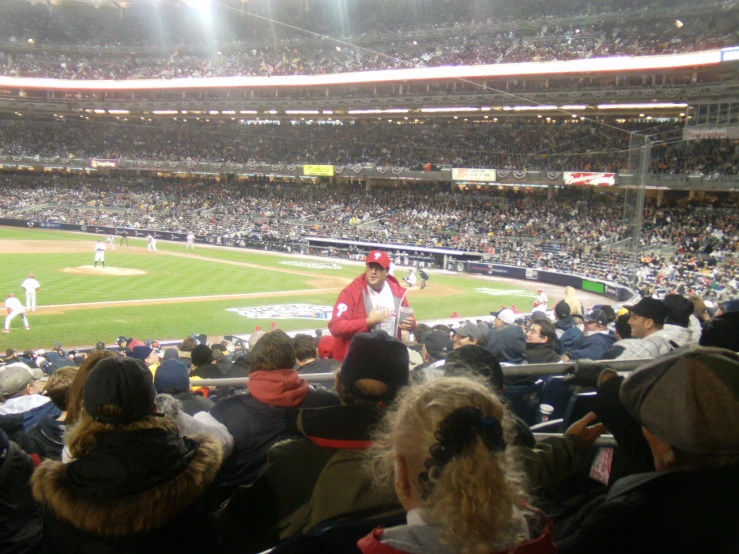 a view of a baseball field and crowd from the stands