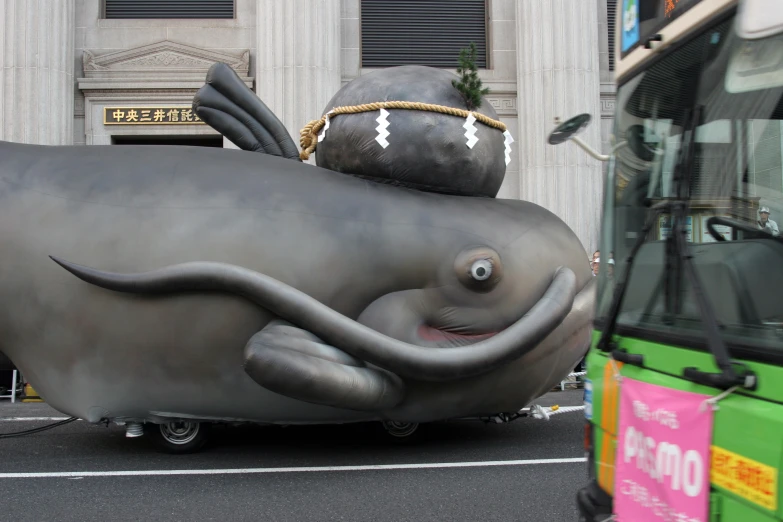 an elephant shaped balloon with a hat on top