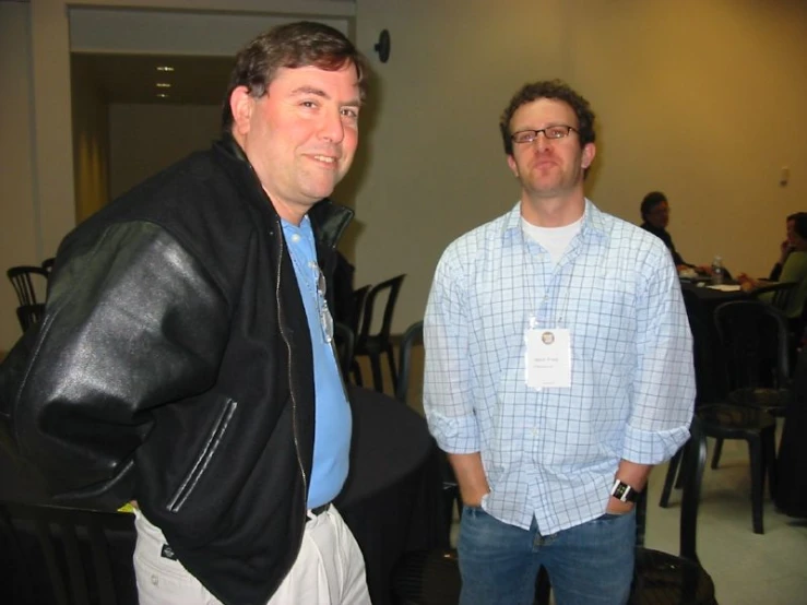 a couple of men standing in a room