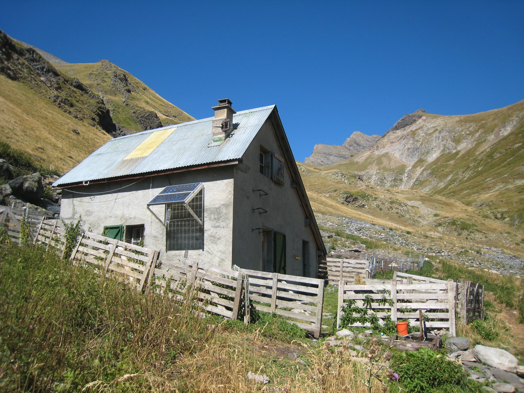 this small building sits on the side of a hill