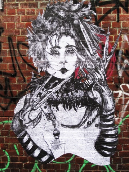 graffiti drawing of a woman with a gun on a brick wall