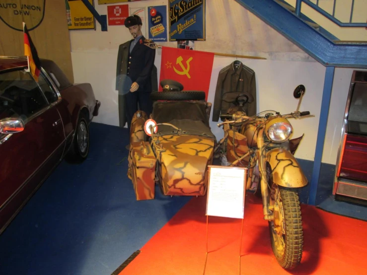 a man standing next to a motorcycle in a garage