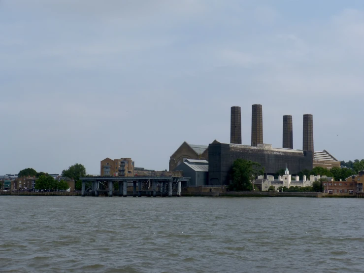 a river next to some buildings on top of it