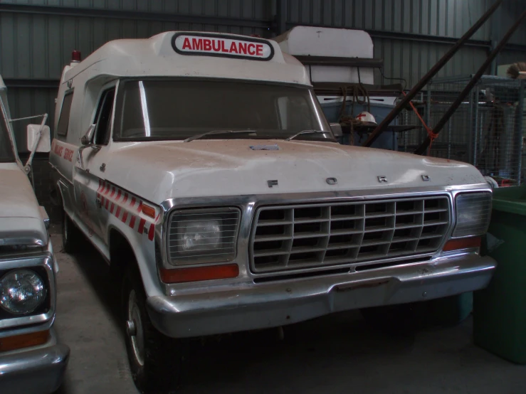 an ambulance has a man standing behind it