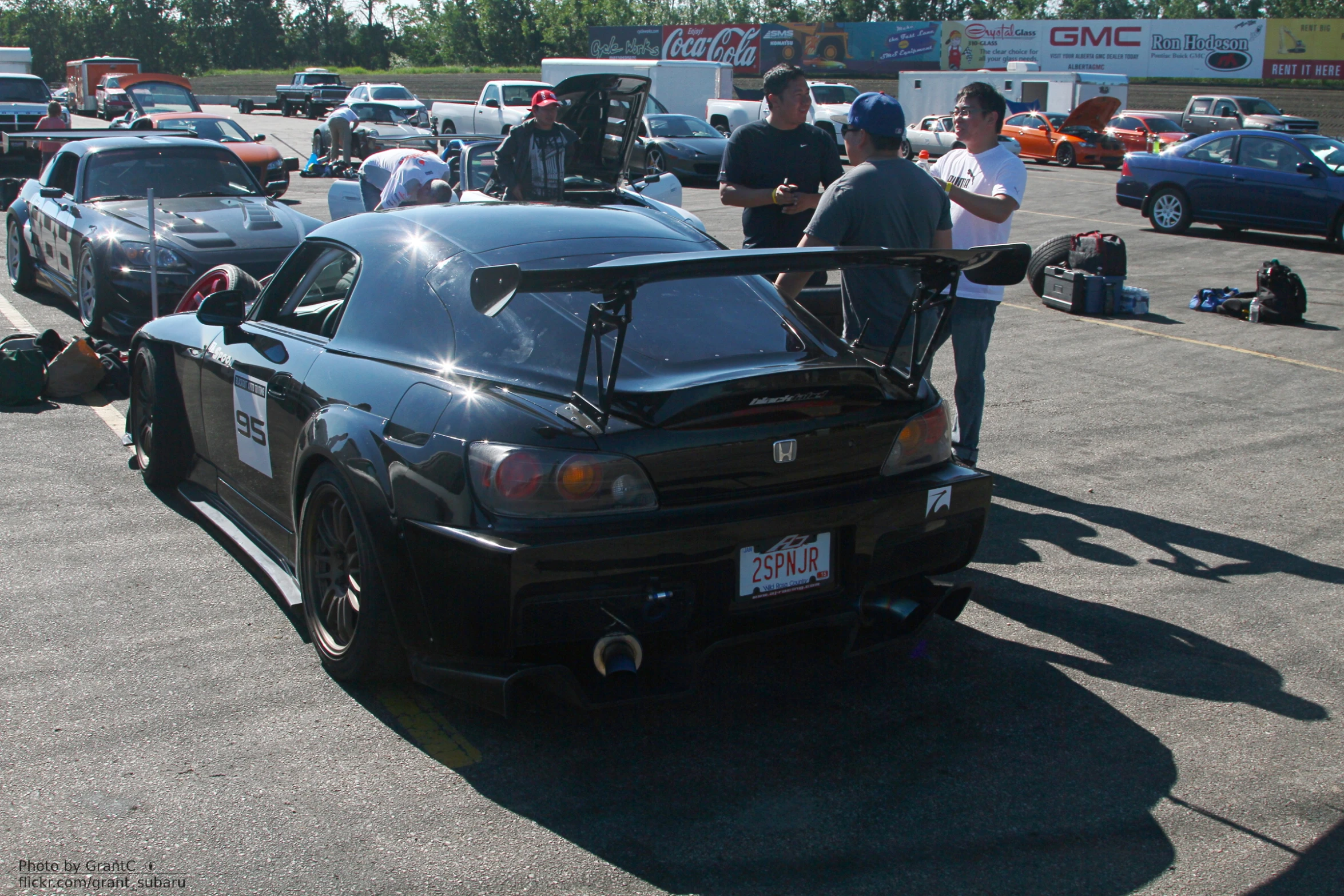 an event is getting started with cars ready for drag racing