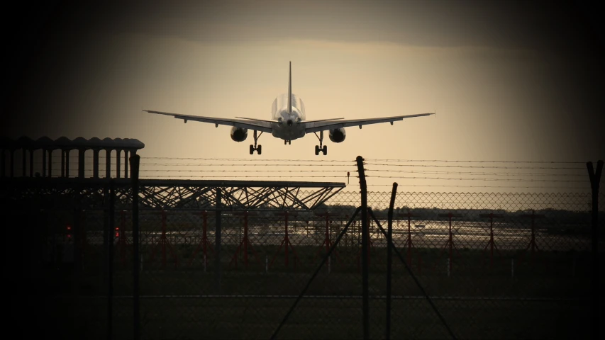 an airplane landing on an airport runway