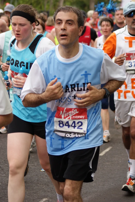 a man running in a marathon in the street