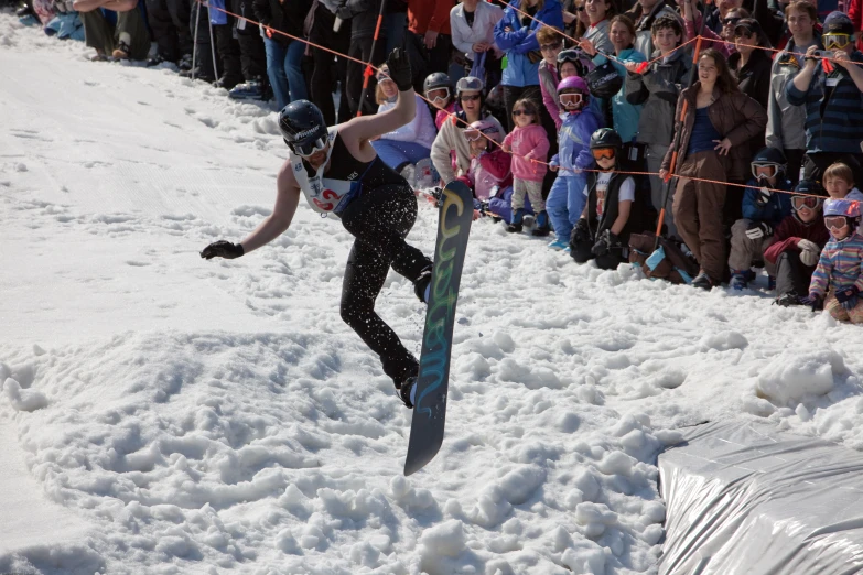 a man is performing tricks on a snowboard while in mid air