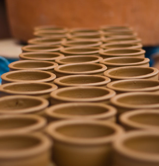 a close up of stacks of brown cups