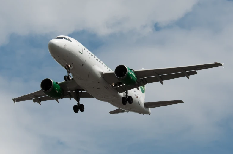 a large air plane is flying in the sky