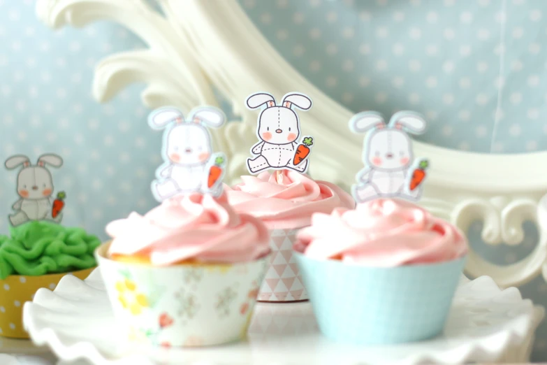 cupcakes with pink frosting and bunny on top