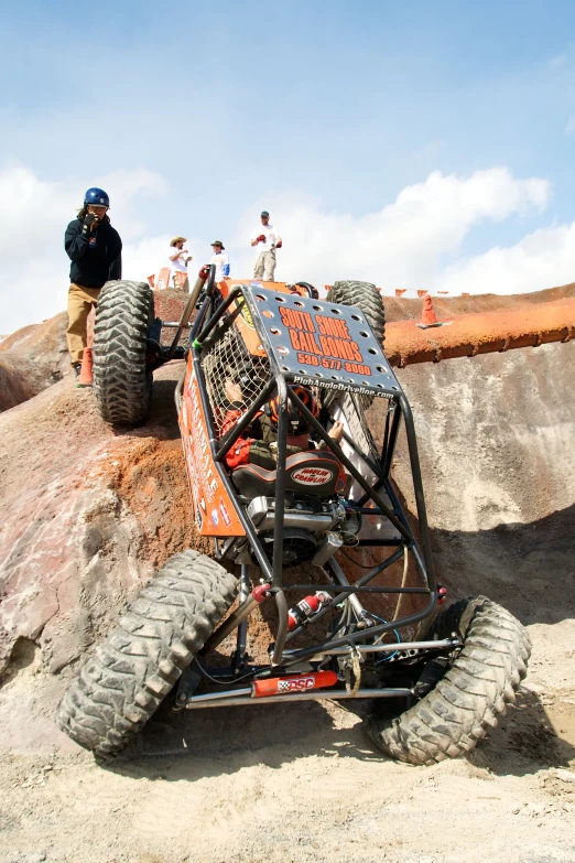 a buggy truck with four large tires on a hill