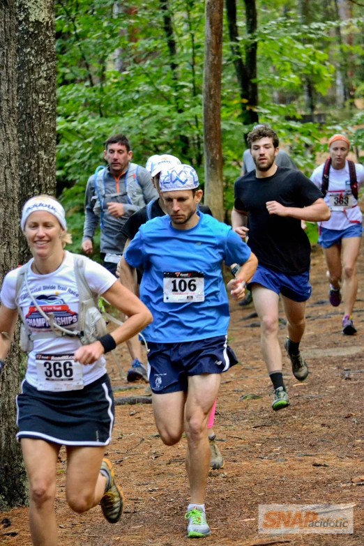 several people running in the woods