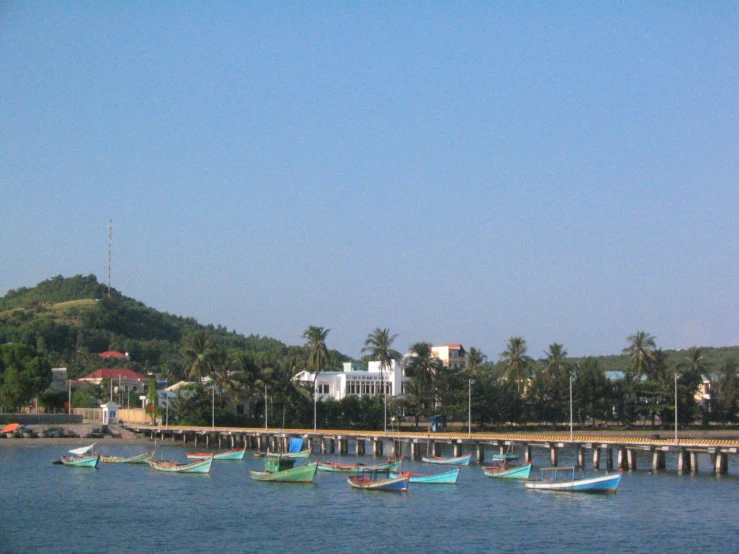 small boats on the water in a big river