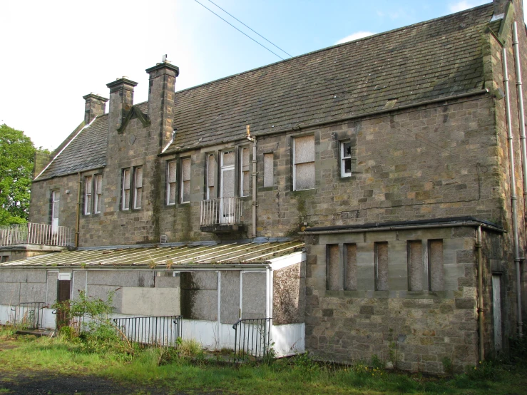 an old run down building with a lot of windows and windows