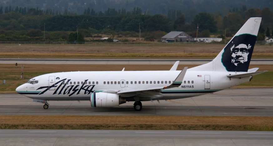 an alaska airlines jet plane on a runway