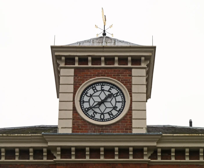 a clock sits on top of a brick building