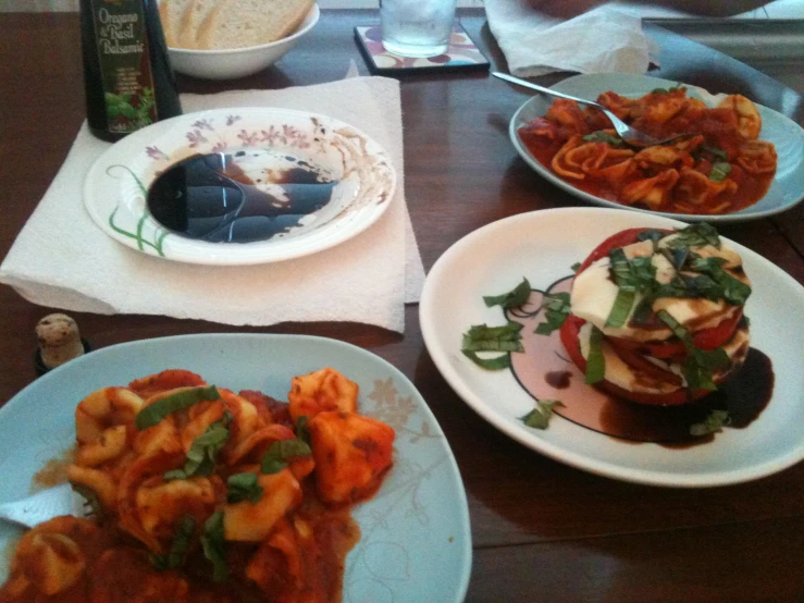 a person sits at a table with plates of food