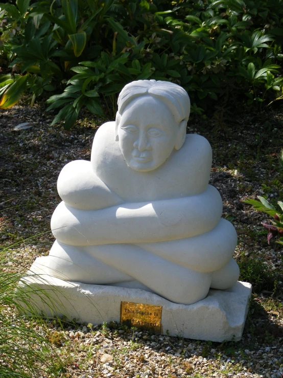 a cement sculpture in the shape of a buddha head