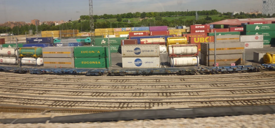 a train yard with freight cars on top of tracks