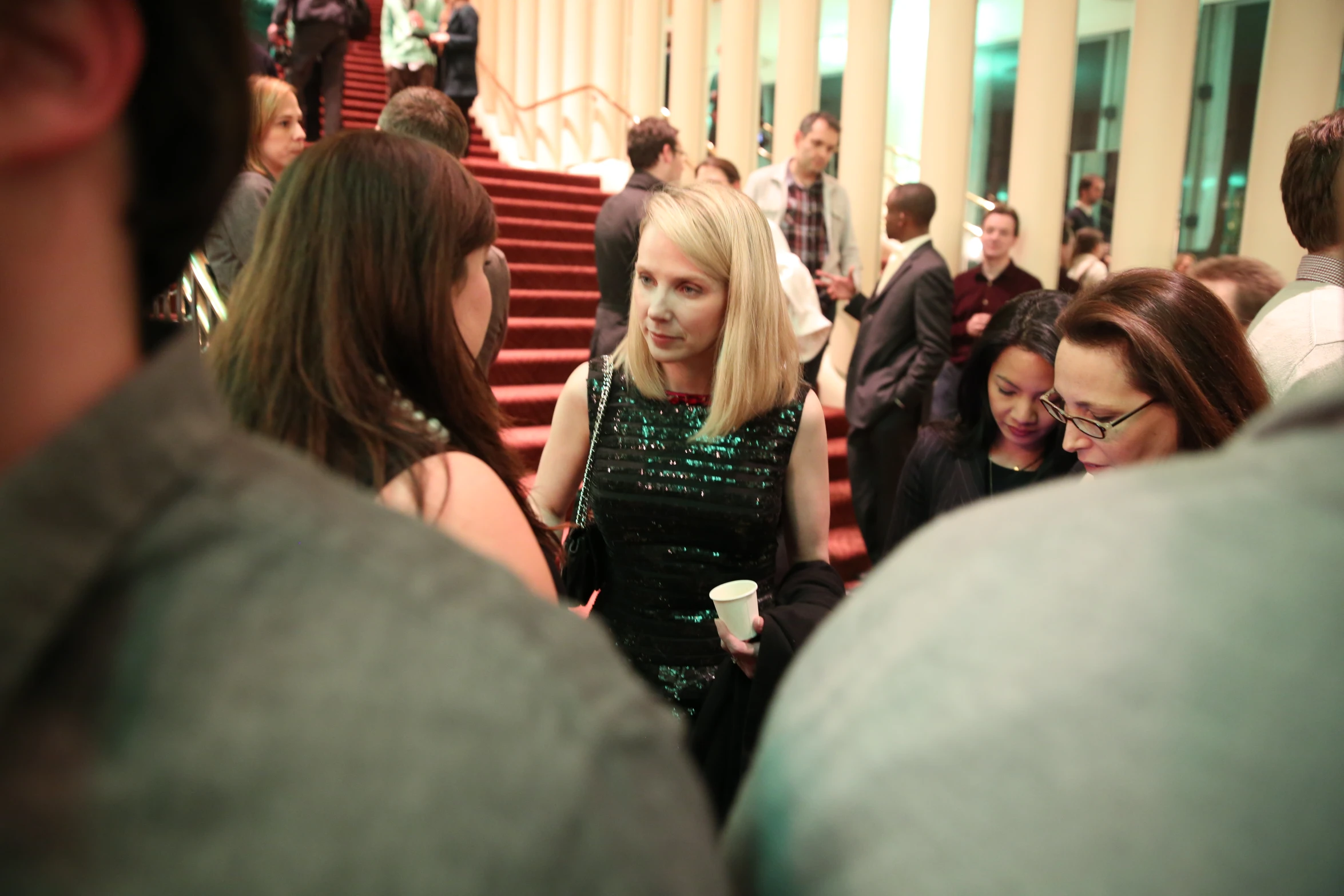 a woman that is standing up looking at someone