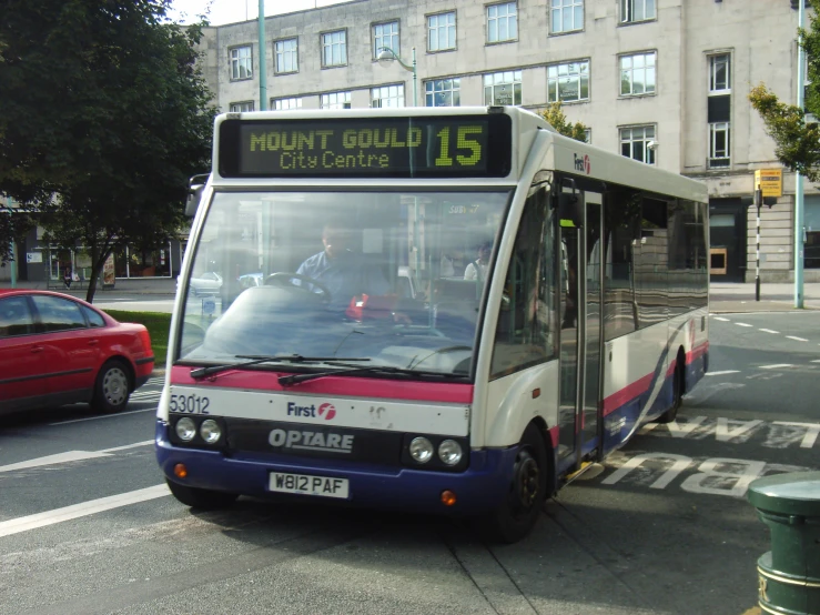 an image of a bus on the road near cars