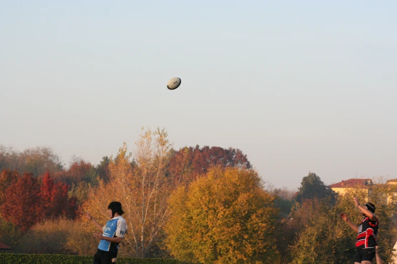 a person wearing a blue shirt flying a kite