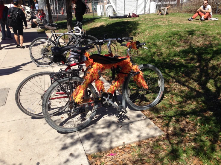 a group of bikes with fire flames on them sitting on the street