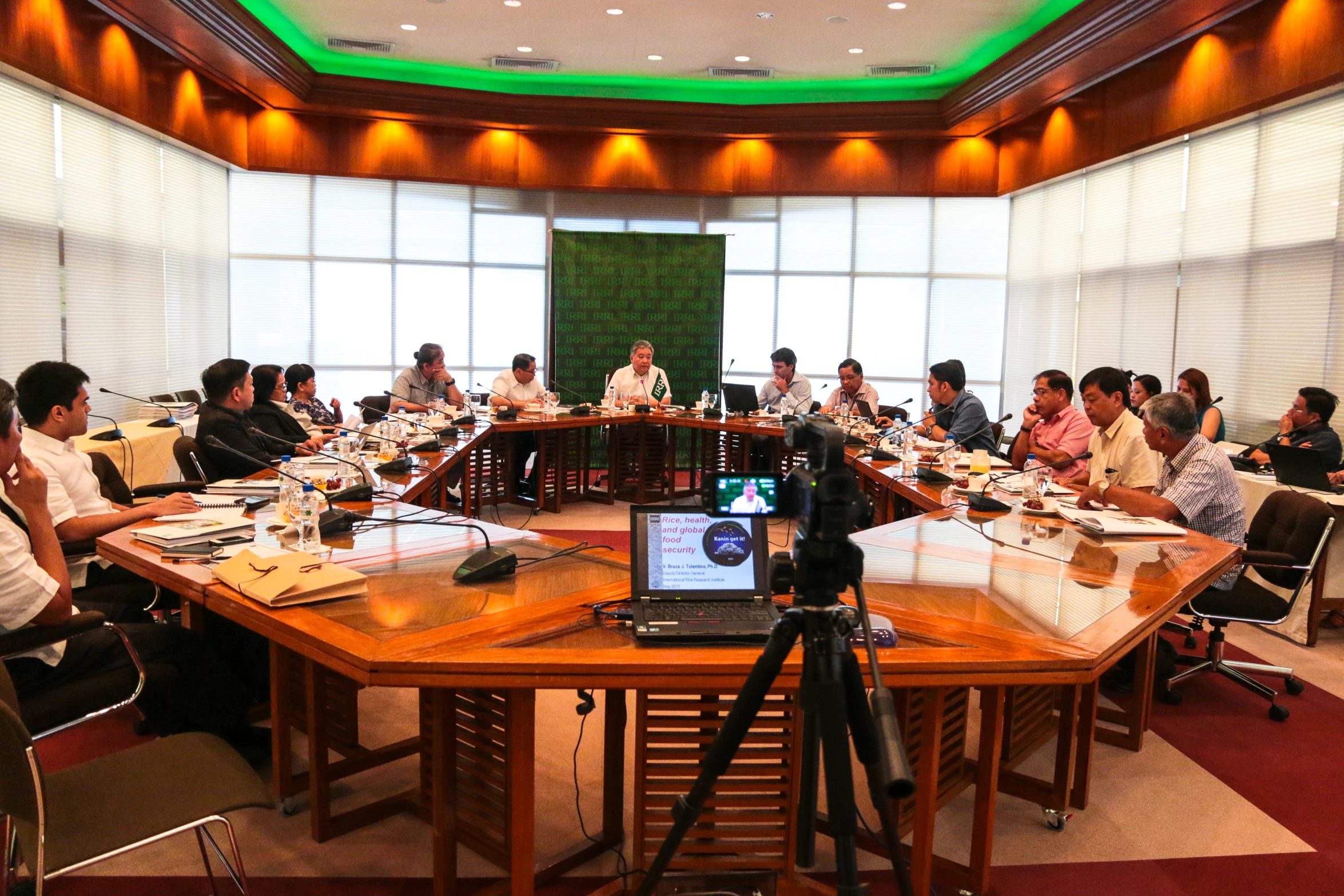 several people seated at tables eating and talking