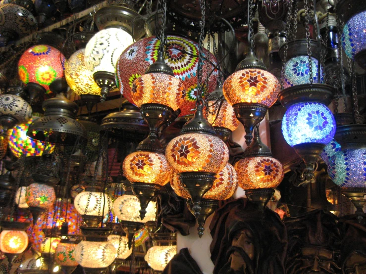 some lamps and lights hanging from the ceiling