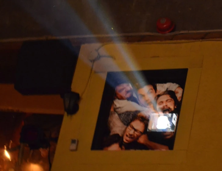 a po frame holds three people and a light