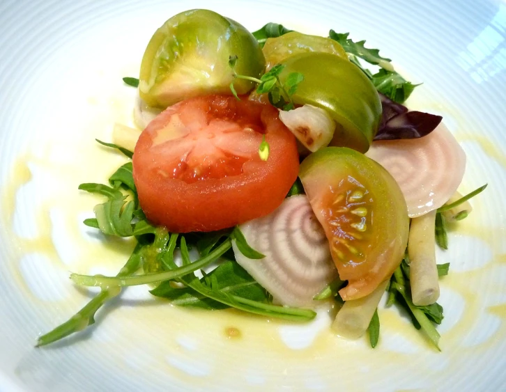 a white plate holding some type of salad