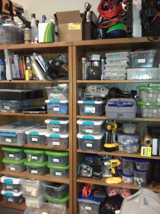 the shelves hold several boxes and other items