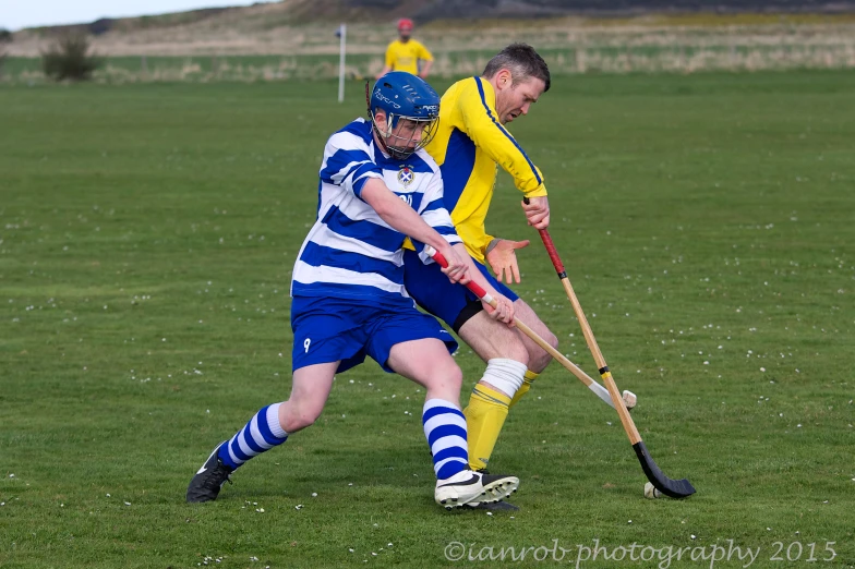 two boys compete with each other in a field