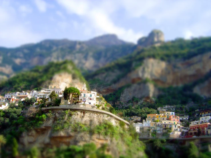 a beautiful landscape s from an upward angle of the town perched at a high mountain
