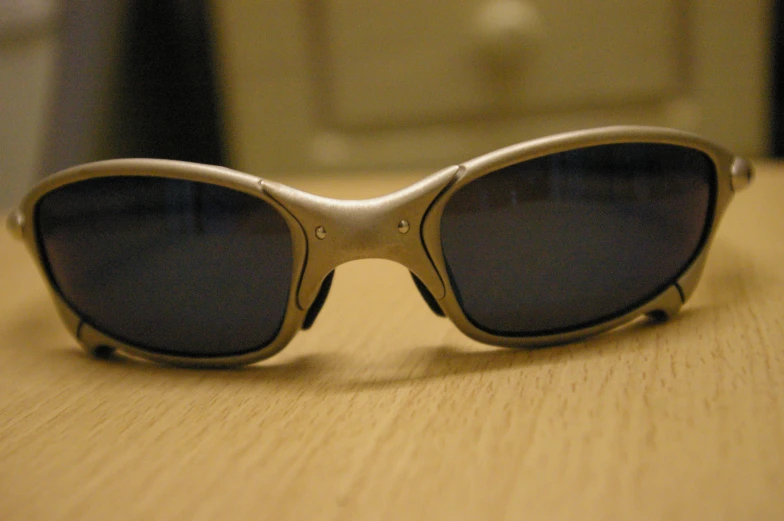 the front of a pair of sunglasses on a table