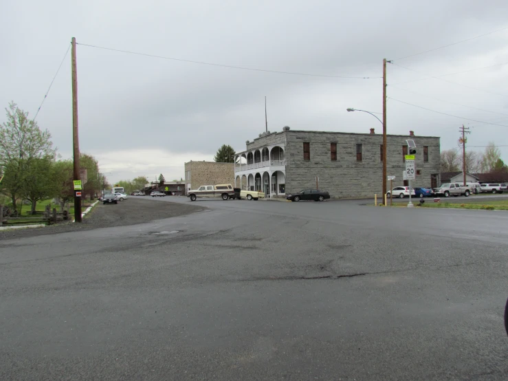 some cars and a building on the street