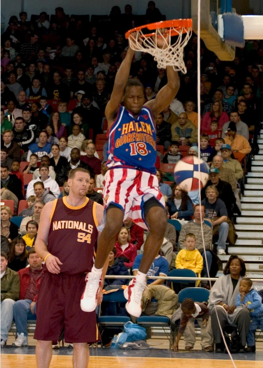 an individual is doing soing with the hoop in the stadium