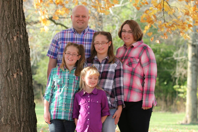 a family is posing for a portrait together