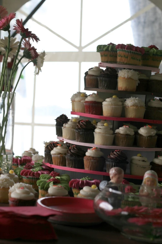 a bunch of cupcakes are sitting on the table