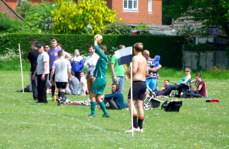 several guys are outside playing some sports