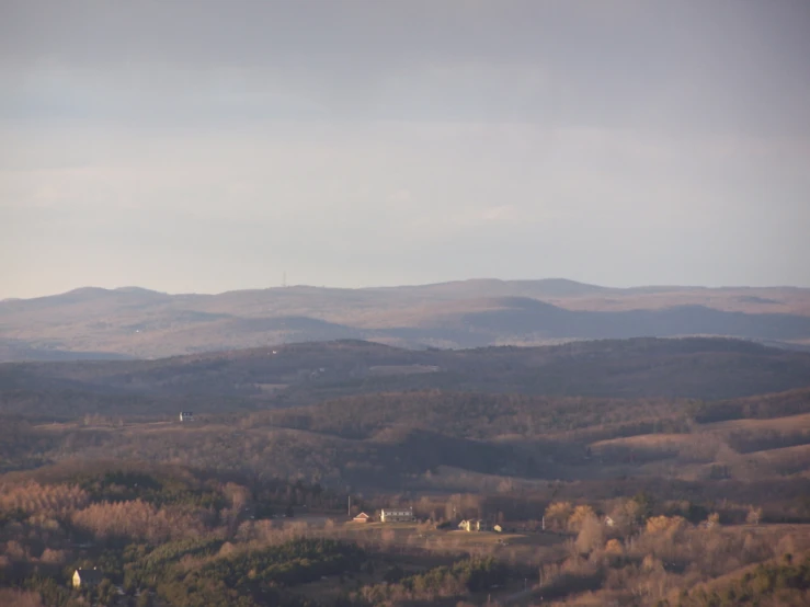 a large group of mountains sitting in the distance