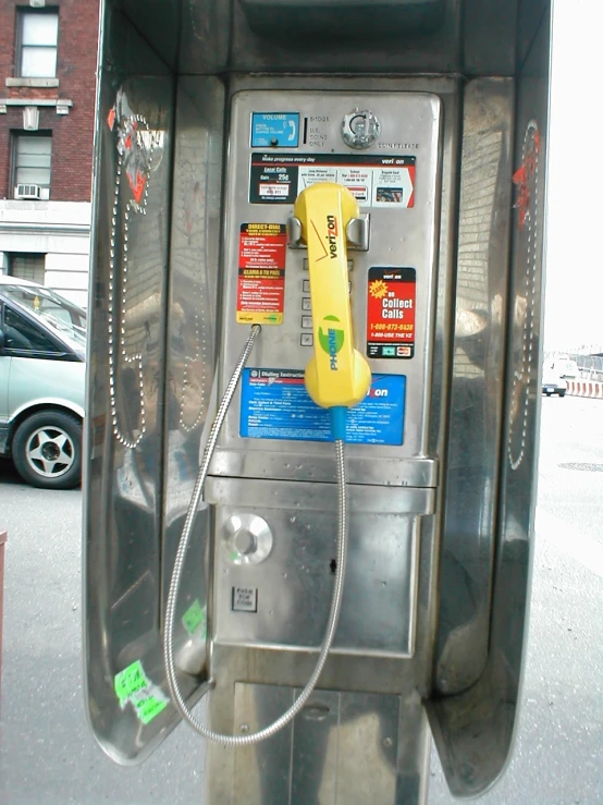 an old payphone with ons and wires