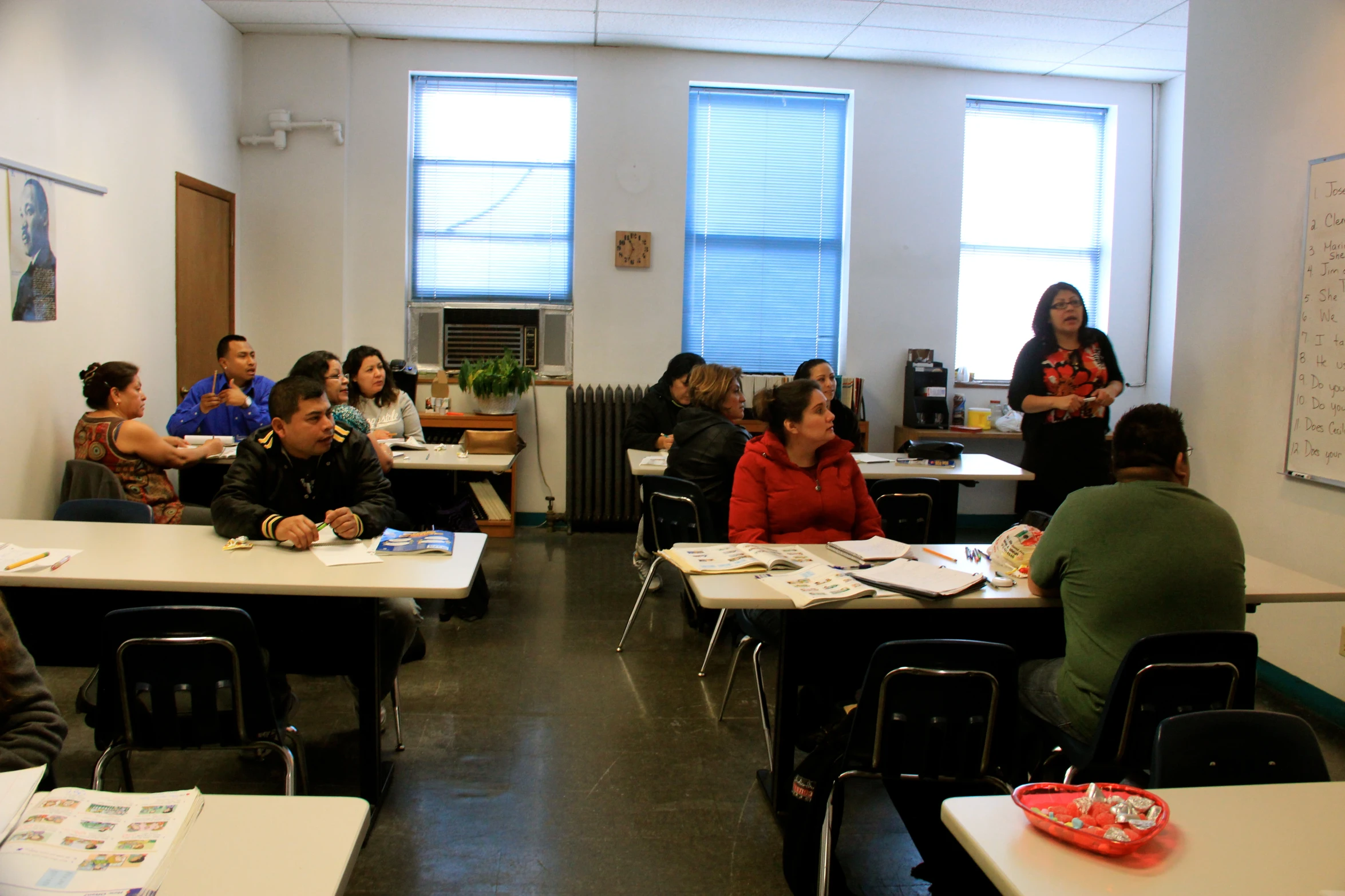 a classroom that is very well decorated and has people sitting at desks