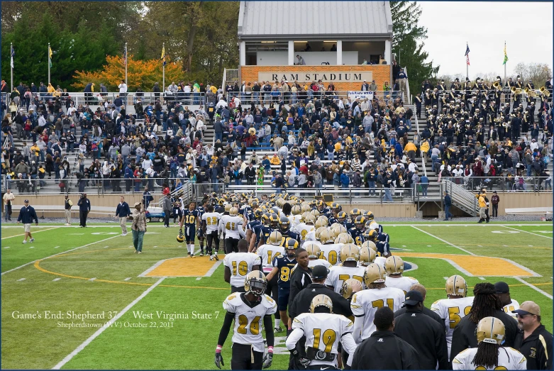 several people are standing on a football field