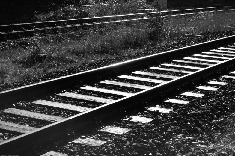 a black and white po of an old railroad track